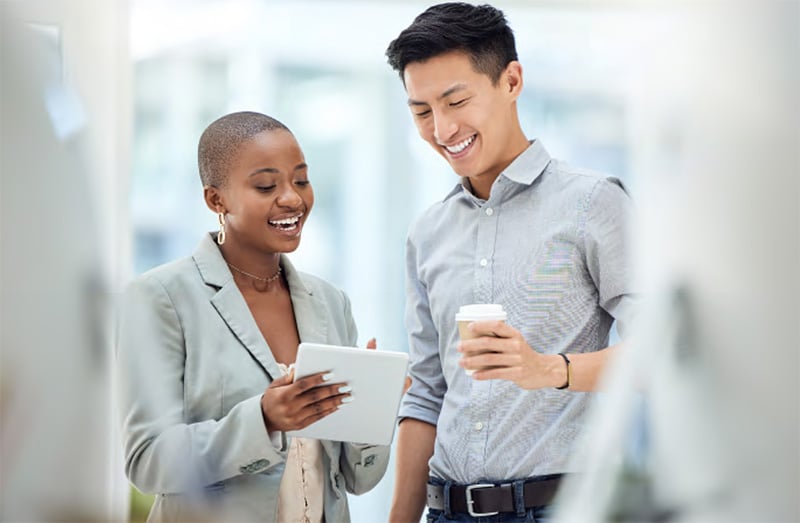 two people looking at tablet